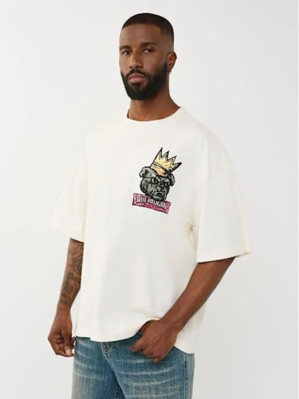 True Religion Cream Short Sleeve Tee with Crowned Dog Graphic and Brand Banner